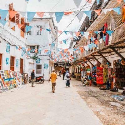 Stone Town: Local people on a street in Stone Town. Stone Town is the old part of Zanzibar City, the capital of Zanzibar, Tanzania